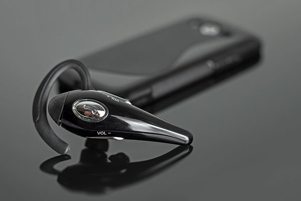 Picture of cell phone and bluetooh earpiece