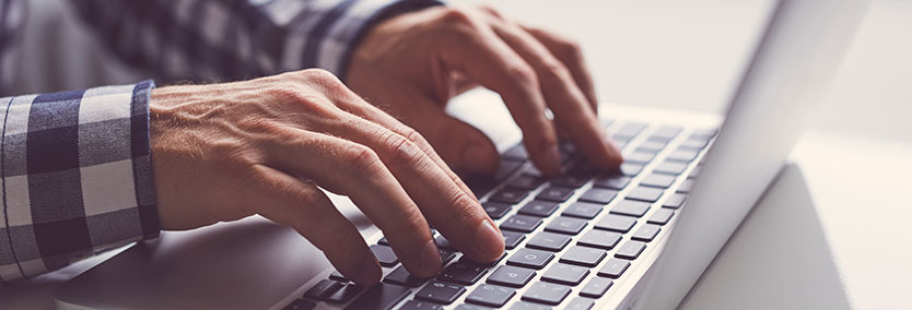 Find the resources you need with KPA Man typing on laptop keyboard